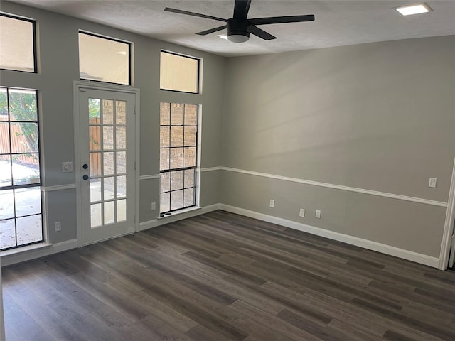 doorway to outside featuring dark hardwood / wood-style flooring and ceiling fan