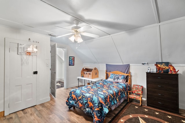 bedroom featuring light hardwood / wood-style flooring, ceiling fan, and lofted ceiling