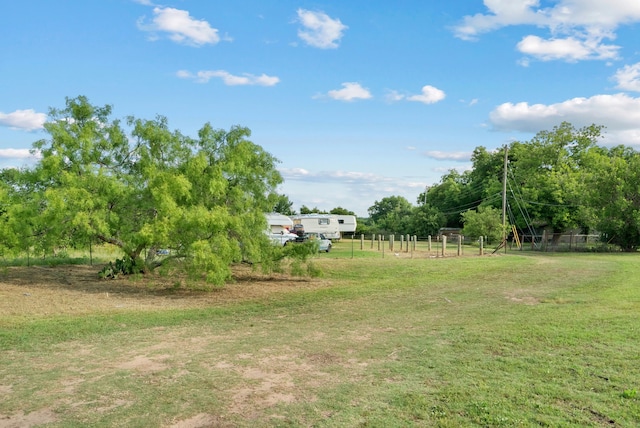 view of yard with a rural view