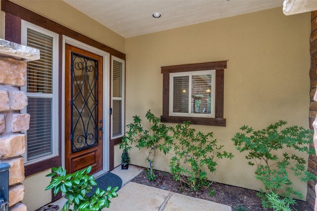 property entrance featuring covered porch