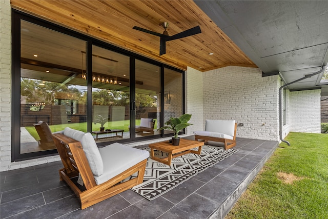 view of patio / terrace with ceiling fan and an outdoor living space