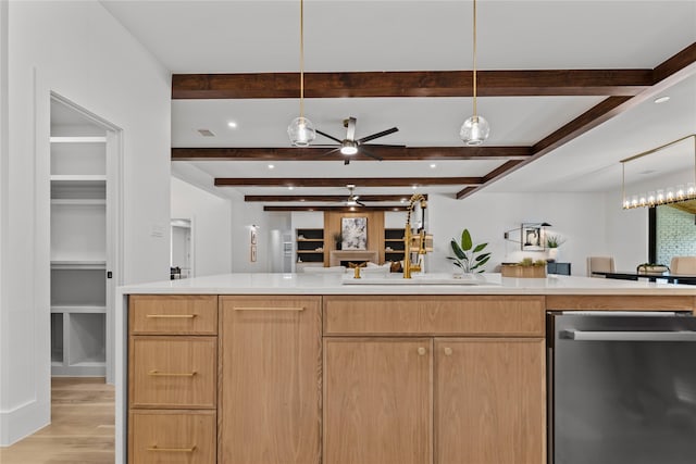 kitchen featuring sink, decorative light fixtures, dishwasher, beam ceiling, and light hardwood / wood-style floors