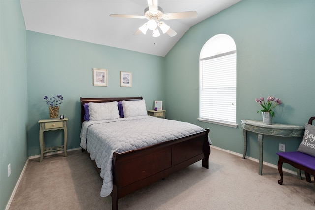 bedroom with lofted ceiling, light colored carpet, and ceiling fan