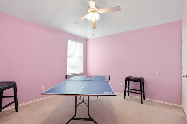 game room featuring light colored carpet and ceiling fan