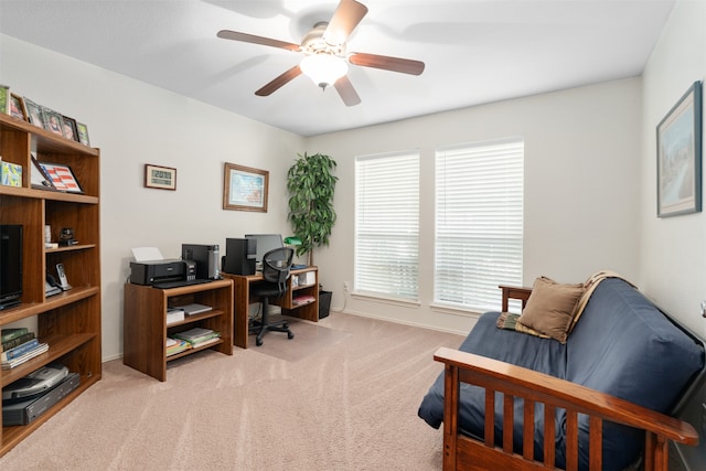 office space featuring light colored carpet and ceiling fan