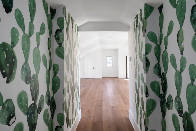 entryway with lofted ceiling and hardwood / wood-style flooring