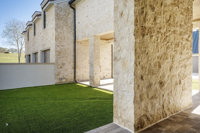 455 Sun Vly, Mabank, TX 75147 - view of home's exterior with stone siding, a yard, and stucco siding