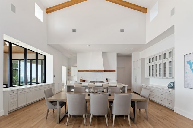 455 Sun Vly, Mabank, TX 75147 - dining area with high vaulted ceiling, light wood-type flooring, and beamed ceiling