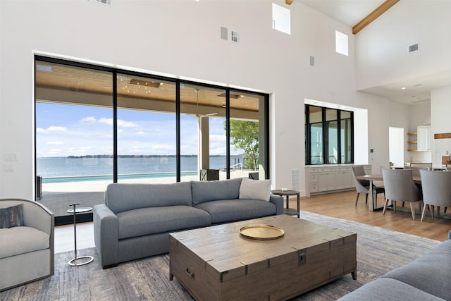 455 Sun Vly, Mabank, TX 75147 - living room with a high ceiling, wood finished floors, beamed ceiling, and a water view