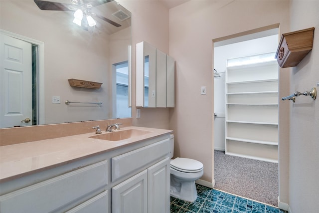 12228 Saddle Club Dr, Forney, TX 75126 - bathroom with visible vents, ceiling fan, toilet, and vanity