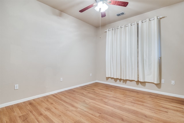 spare room with ceiling fan and light hardwood / wood-style floors