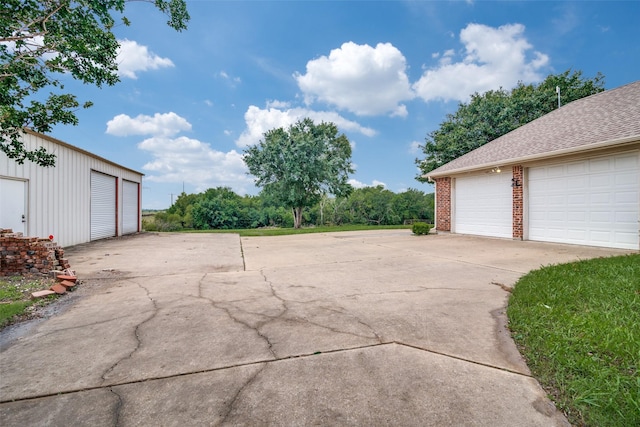 12228 Saddle Club Dr, Forney, TX 75126 - exterior space with a garage and an outbuilding