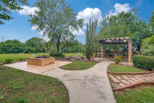 surrounding community with a fire pit, a pergola, a patio, and a lawn