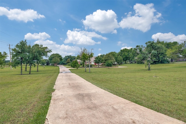 view of home's community featuring a lawn