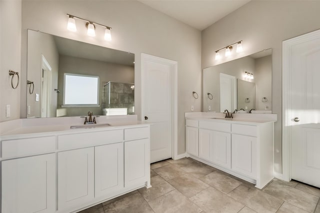 bathroom featuring vanity and an enclosed shower