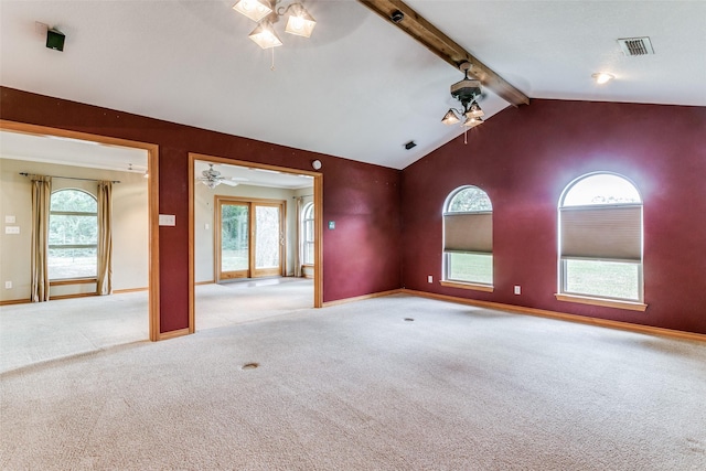 carpeted spare room with vaulted ceiling with beams and ceiling fan