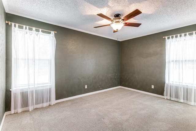 spare room with ceiling fan, carpet floors, and a textured ceiling