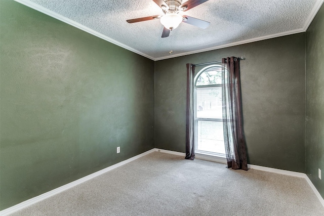 unfurnished room featuring a textured ceiling, carpet floors, ceiling fan, and crown molding