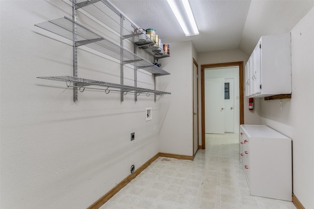 laundry room with cabinets, hookup for a washing machine, and hookup for an electric dryer