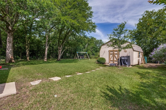 view of yard featuring a shed and a playground