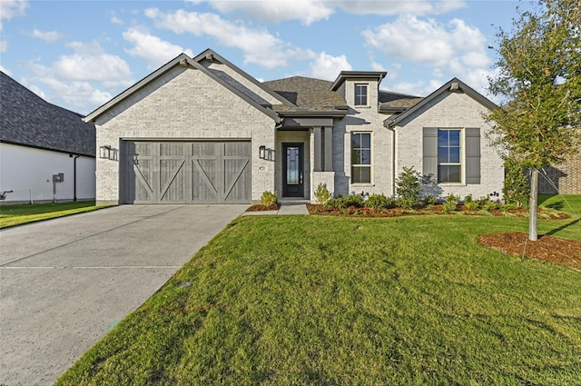 view of front of house with a front lawn and a garage