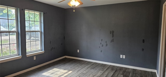 empty room featuring ceiling fan and hardwood / wood-style flooring