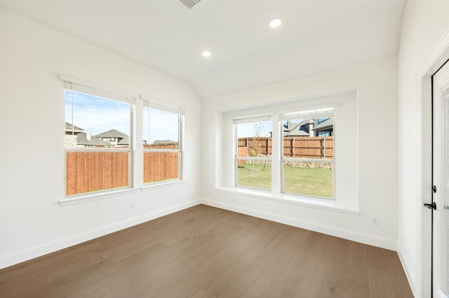 unfurnished sunroom with lofted ceiling