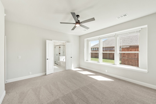 unfurnished bedroom with light carpet and ceiling fan