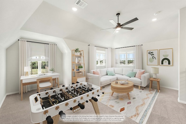 interior space featuring a wealth of natural light, lofted ceiling, ceiling fan, and light colored carpet