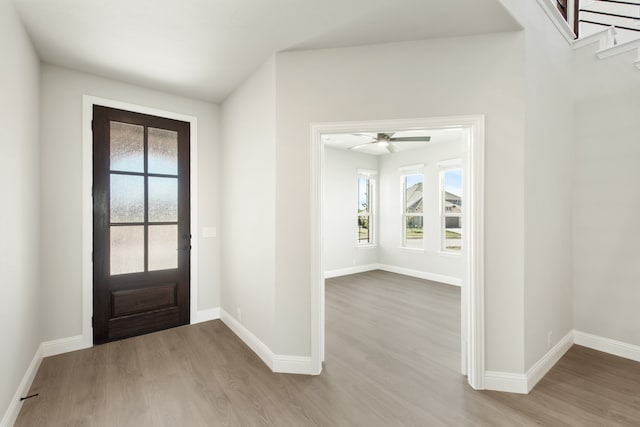 entrance foyer featuring light hardwood / wood-style flooring and ceiling fan