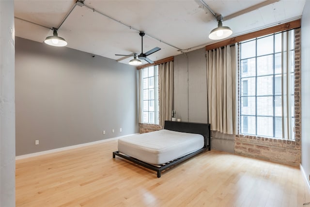 bedroom with hardwood / wood-style flooring