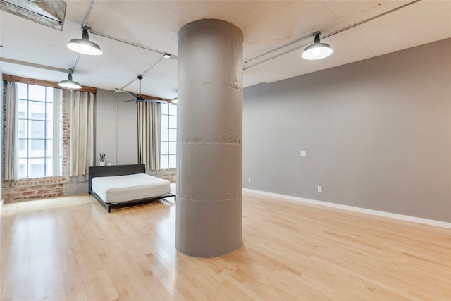 unfurnished bedroom with light wood-type flooring