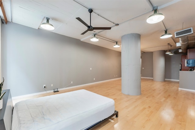 bedroom featuring hardwood / wood-style flooring and ceiling fan