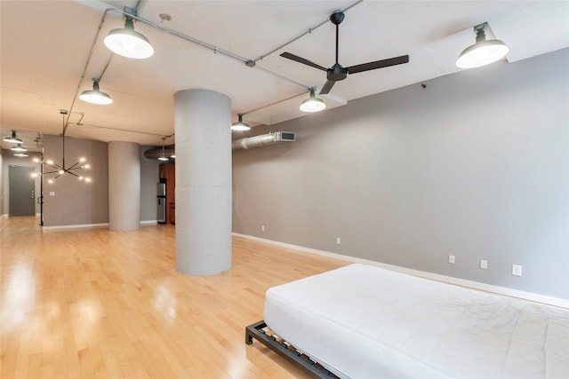 interior space with a chandelier and wood-type flooring