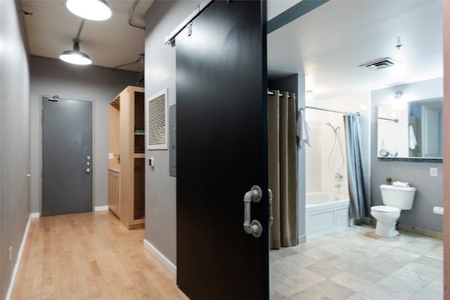 hallway with light hardwood / wood-style flooring