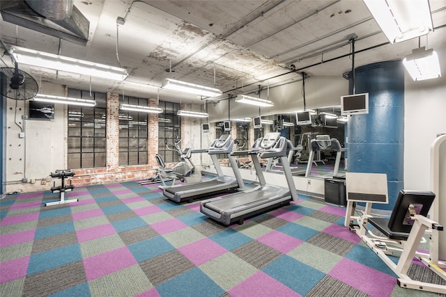 exercise room featuring carpet