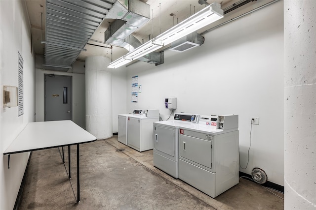 clothes washing area featuring washer and dryer