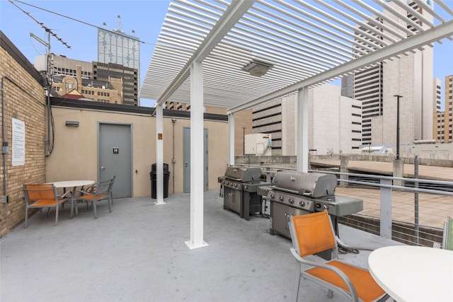 view of patio with a pergola and grilling area