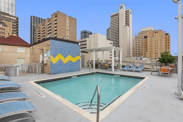 view of pool featuring a patio