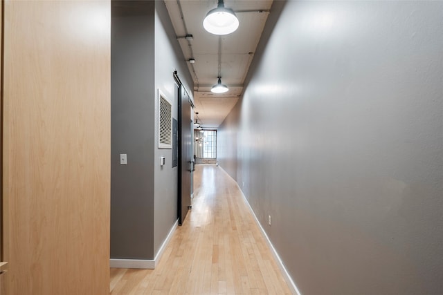 hall with light hardwood / wood-style floors