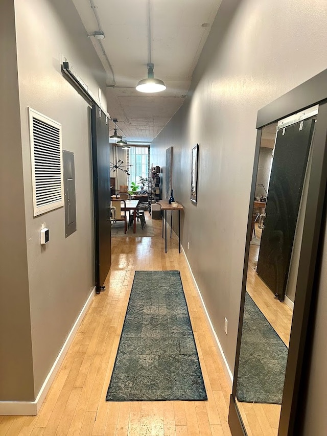 hallway featuring light wood-type flooring