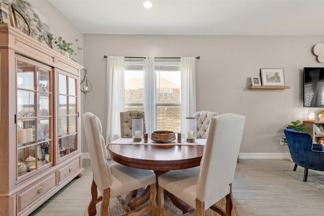 dining space featuring light wood-type flooring