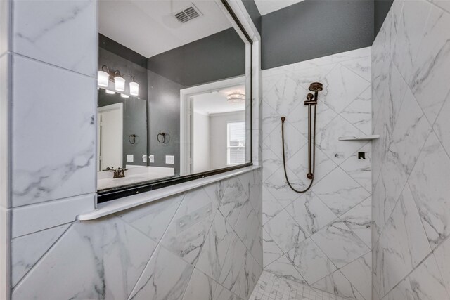 bathroom with tiled shower