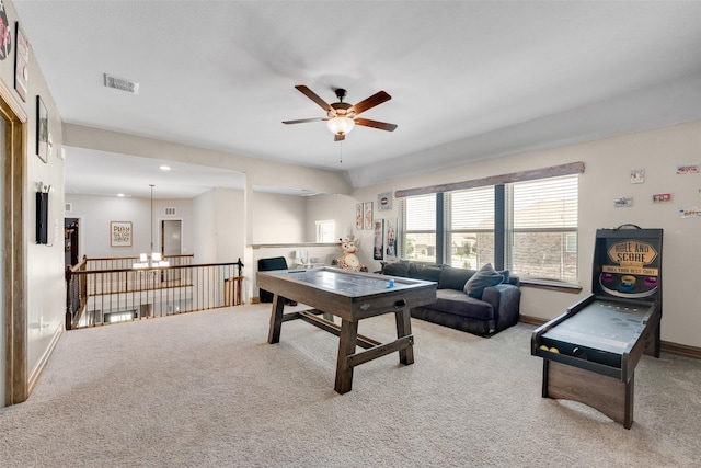 recreation room featuring ceiling fan and light colored carpet