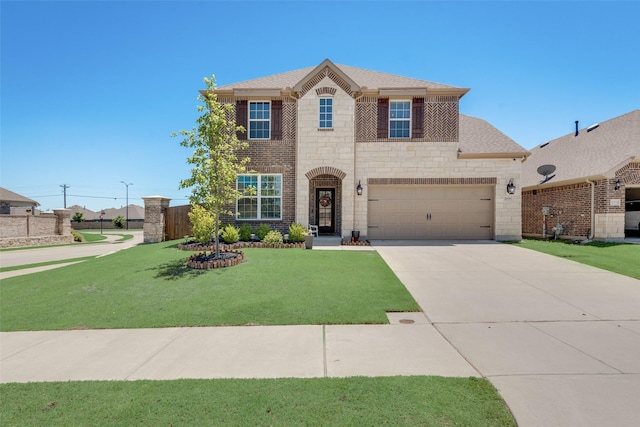 view of front facade with a garage and a front yard