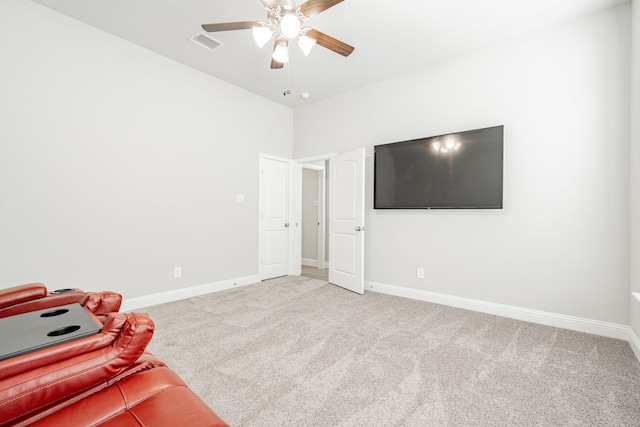 interior space featuring light carpet and ceiling fan