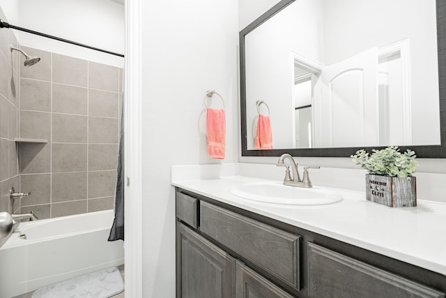 bathroom with shower / bath combo and vanity