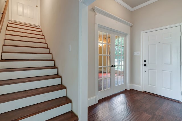 entryway featuring dark hardwood / wood-style floors, crown molding, and french doors