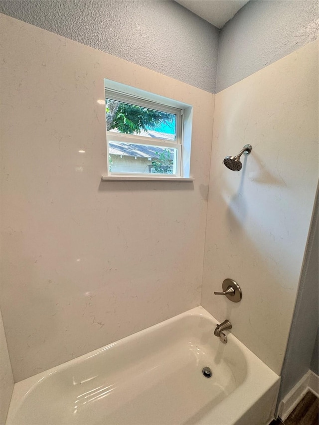 full bath featuring shower / washtub combination