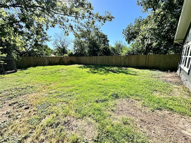 view of yard featuring a fenced backyard